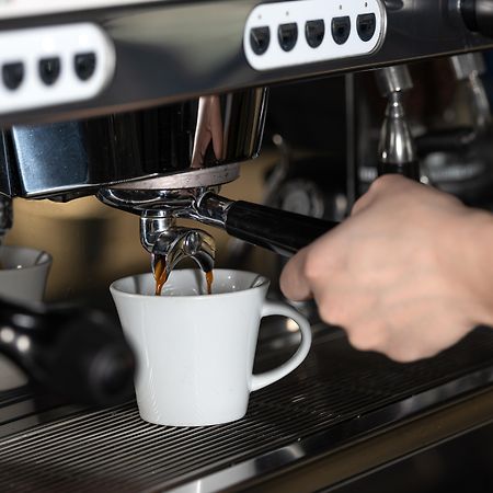 Santorini Kastelli Resort Kamári Dış mekan fotoğraf Espresso machine